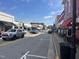 Downtown street with businesses, crosswalks, cars and pedestrians representing a lively urban environment at 1004 Taywood Way, Apex, NC 27502