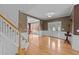 Elegant foyer with hardwood floors, staircase, and a decorative front door with sidelights at 1004 Taywood Way, Apex, NC 27502