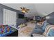 Large game room featuring a foosball table, pool table, TV, and comfortable seating, perfect for entertaining at 1004 Taywood Way, Apex, NC 27502
