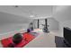 Spacious home gym with exercise equipment, including a treadmill and a stationary bike at 1004 Taywood Way, Apex, NC 27502
