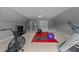 Spacious home gym with exercise equipment, including a treadmill and a stationary bike at 1004 Taywood Way, Apex, NC 27502