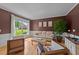 Cozy living room featuring hardwood floors, large windows, and tasteful decor at 1004 Taywood Way, Apex, NC 27502