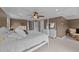 Spacious main bedroom with a four-poster bed, ceiling fan, dresser and doorway at 1004 Taywood Way, Apex, NC 27502