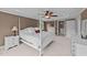 Comfortable primary bedroom featuring a four-poster bed, carpet, and stylish decor at 1004 Taywood Way, Apex, NC 27502