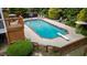 Beautiful in-ground pool featuring a diving board and a wooden deck area with seating at 1004 Taywood Way, Apex, NC 27502