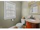 Cozy powder room with granite countertop and modern fixtures at 1004 Taywood Way, Apex, NC 27502