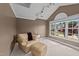 Cozy sitting area with comfortable seating, natural light, and neutral color palette at 1004 Taywood Way, Apex, NC 27502