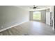 Spacious bedroom with hardwood flooring, natural light, and a view to the outside at 1039 Bellenden Dr, Durham, NC 27713