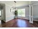 Elegant dining room with hardwood floors, decorative molding, and a stylish chandelier at 1039 Bellenden Dr, Durham, NC 27713