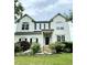 Traditional two-story home with symmetrical design, dormers, and a well-manicured front lawn at 1039 Bellenden Dr, Durham, NC 27713