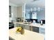Modern kitchen featuring quartz counters, open floor plan, and high-end stainless steel appliances at 1039 Bellenden Dr, Durham, NC 27713