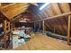 Spacious attic with exposed wooden beams and ample storage potential for organizational needs at 108 Farren Ct, Cary, NC 27511