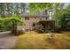 Expansive backyard featuring a lush lawn, patio, and screened-in porch perfect for entertaining at 108 Farren Ct, Cary, NC 27511