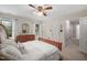 Cozy bedroom featuring a wooden bed frame, dresser, and ample natural light from the windows at 108 Farren Ct, Cary, NC 27511