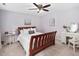 Relaxing bedroom with wood frame bed, ceiling fan, and soothing decor for a peaceful retreat at 108 Farren Ct, Cary, NC 27511