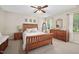 Serene bedroom with natural light, wood furnishings, and soft decor at 108 Farren Ct, Cary, NC 27511