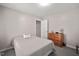 Cozy bedroom featuring a wood dresser with a large window providing natural light at 108 Farren Ct, Cary, NC 27511