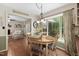 Charming dining area filled with natural light, hardwood floors, and views of the lush backyard at 108 Farren Ct, Cary, NC 27511