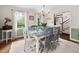 Elegant dining room featuring hardwood floors, a stylish table, and a chandelier at 108 Farren Ct, Cary, NC 27511