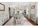 Charming dining area with hardwood floors, a vintage record player, and natural light at 108 Farren Ct, Cary, NC 27511