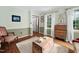 Cozy living room featuring hardwood floors, a neutral rug, and comfortable seating at 108 Farren Ct, Cary, NC 27511