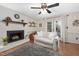 Relaxing living room with fireplace, french doors, hardwood floors and natural light at 108 Farren Ct, Cary, NC 27511