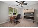 Home office with dual desks, comfortable chair, and ceiling fan; perfect for productivity at 108 Farren Ct, Cary, NC 27511