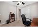 Spare bedroom currently set up as an office space, with shelving for storage and ceiling fan at 108 Farren Ct, Cary, NC 27511