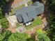 Aerial view of the home's backyard featuring a patio, fire pit area and well-maintained landscaping at 10817 Brass Kettle Rd, Raleigh, NC 27614