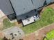 Aerial view of home with deck, fire pit and patio, surrounded by green lawn at 10817 Brass Kettle Rd, Raleigh, NC 27614