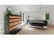 Relaxing bedroom with large windows, hardwood floors, and a comfortable bed at 10817 Brass Kettle Rd, Raleigh, NC 27614