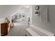 Versatile bonus room features a pitched ceiling, neutral walls, plenty of room for activities, and creative design at 10817 Brass Kettle Rd, Raleigh, NC 27614