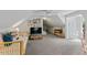 Large bonus room boasts a pitched ceiling, gray carpet, and ample space for entertainment and relaxation for the whole Gathering at 10817 Brass Kettle Rd, Raleigh, NC 27614