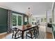 Formal dining room features large windows and stylish decor at 10817 Brass Kettle Rd, Raleigh, NC 27614