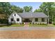 Charming home with inviting front porch and well-manicured lawn and landscaping at 10817 Brass Kettle Rd, Raleigh, NC 27614