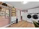 Organized laundry room with modern washer and dryer, ample storage, and tasteful decorations at 10817 Brass Kettle Rd, Raleigh, NC 27614