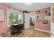 Charming home office with a large window, vintage decor, and plenty of natural light at 10817 Brass Kettle Rd, Raleigh, NC 27614