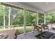 Inviting screened porch perfect for relaxing and enjoying the outdoors at 10817 Brass Kettle Rd, Raleigh, NC 27614