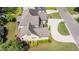 Aerial view of a home with gray roof, well-manicured lawn, and basketball hoop over driveway at 1101 Temple St, Raleigh, NC 27609