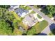 Aerial shot featuring home with a well-maintained backyard, fire pit, and manicured landscaping at 1101 Temple St, Raleigh, NC 27609