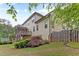Backyard featuring a deck, lush green landscaping, and a privacy fence at 1101 Temple St, Raleigh, NC 27609