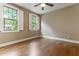 Bedroom with hardwood floors, neutral walls, and natural light at 1101 Temple St, Raleigh, NC 27609