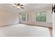 Bright bedroom with a ceiling fan and plantation shutters allowing natural light at 1101 Temple St, Raleigh, NC 27609