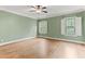 Bedroom with bright windows, hardwood flooring, crown molding, and neutral paint at 1101 Temple St, Raleigh, NC 27609