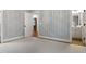 Bedroom featuring patterned wallpaper, neutral carpet, and white trim at 1101 Temple St, Raleigh, NC 27609