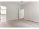 Bright bedroom with carpeted floors and neutral paint, leads to a walk-in closet at 1101 Temple St, Raleigh, NC 27609