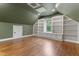 Bedroom with hardwood floors, built-in shelving, and a window at 1101 Temple St, Raleigh, NC 27609