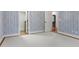 Bedroom featuring patterned wallpaper, neutral carpet, and white trim at 1101 Temple St, Raleigh, NC 27609