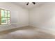 Bedroom featuring carpeted floors, a window with open shutters, and a ceiling fan at 1101 Temple St, Raleigh, NC 27609