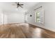 Bonus room featuring hardwood floors, several bright windows, and neutral paint at 1101 Temple St, Raleigh, NC 27609